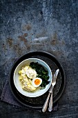 Mustard eggs with mashed potato and spinach