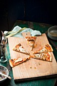 Porcini pizza on a wooden board