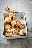 Puff pastry parcels with jam and thyme in an enamel dish