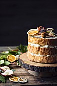 Angel cake with dried fruit on wooden table
