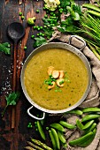 Vegetable cream soup on dark rustic background