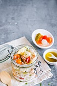 Rice salad with tuna and vegetables in a glass jar (Italy)