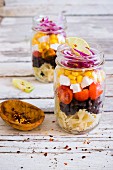 Mexican pasta salad in a glass jar