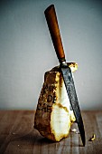 A piece of unpasteurised goat's cheese and an old knife