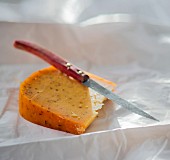 A slice of Gouda with caraway seeds