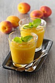 Apricot gazpacho with mint leaves