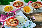 Puff pastry tarts with fruit and vanilla ice cream on a garden table