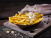 Homemade french fries with salt and spring onion mayonnaise