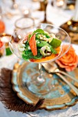 A festive lobster salad with shrimps, limes and chilli in a cocktail glass