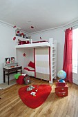 Red accents and bunk beds in children's bedroom