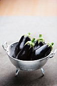 Eggplants in a colander