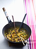 Chicken with mushrooms and red cabbage in a wok