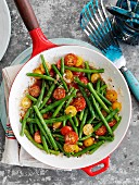 Green beans with red and yellow cherry tomatoes in a balsamic dressing
