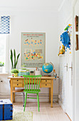 Green chair at desk in vintage-style child's bedroom