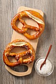 Two pretzels on a wooden board