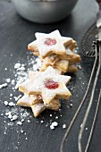 Star shaped jam cookies with icing sugar