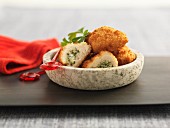 Chicken kiev appetisers in a bowl