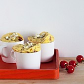 Savoury mug cakes with cocktail tomatoes, goat's cheese and thyme