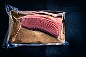 Online fish supplier: shock-frosted loin fillet of salmon in its packaging