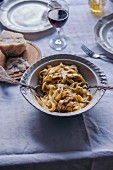 Tagliatelle pasta with black truffle in a vintage bowl