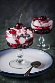 Fool with berries and cherries in dessert glasses