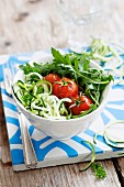 Spiralized courgettes with roasted vine tomatoes and rocket
