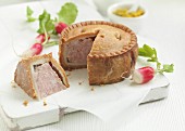 Pork pie, a piece removed (UK)