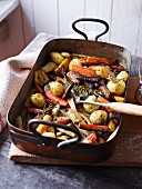 Oven-roasted vegetables in a roasting tin