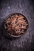 Star anise in a bowl (seen from above)