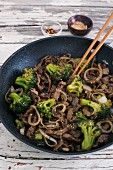 Asian stir fry with beef, broccoli and onion
