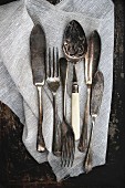 Antique cutlery on a linen cloth