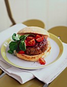 Burger with cocktail tomatoes and salad