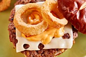 Teriyaki burger with emmental and onion rings