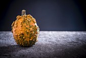A pumpkin on a wooden board