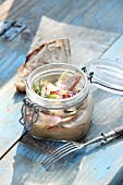 Beer garden salad with radishes in a glass jar