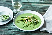 Vegetarian avocado and pea soup with green asparagus