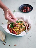 Autumnal potato and nut bowl with pear, beans and bacon