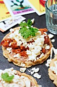 Sope, a traditional Mexican dish with bean purée, chorizo, cheese, sour cream and coriander
