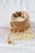 Almond flour in a burlap bag on a linen cloth