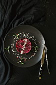 Beetroot tartlet with sesame seeds and cress