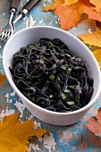 Black noodles with oil and parsley