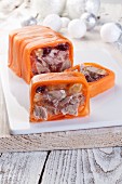 Goose breast in jelly with raisins and cranberries wrapped in carrots sliced