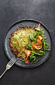 Asparagus and potato rosti with smoked salmon, lime and honey dressing and rocket
