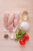 Ingredients for oven-baked chicken breast with tomatoes and mozzarella