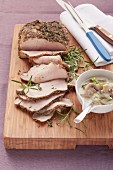 Roast pork with a herb crust and mushroom sauce