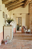 French-style living room with terracotta-tiled floor