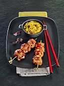 Spicy chicken breast skewers and rice