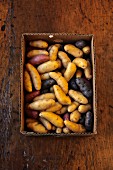 Various types of finger potatoes in crate (supervision)