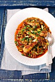 Chicken kebabs with vegetables in tomato sauce