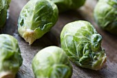 Brussels sprouts on a wooden background (close up)